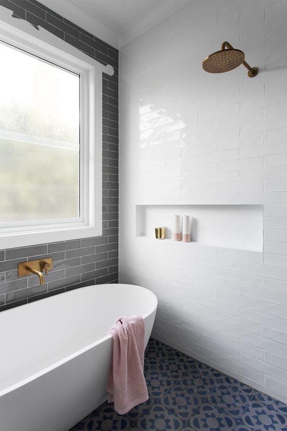 This open shower and tub space looks like a haven forSaturdayy afternoon soaks. The lines are so clean and the hardware so minimal, it's all calming to the eye in fantastic ways.