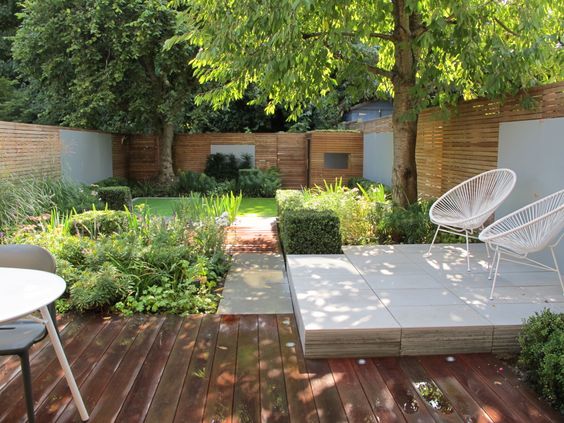 This backyard layout is a bit more doable, but I still don't see #ThisOldHouse having a raised concrete or stone section in the backyard. I also like this image because it starts to think about the privacy fence. Horizontal fencing is in, gang.