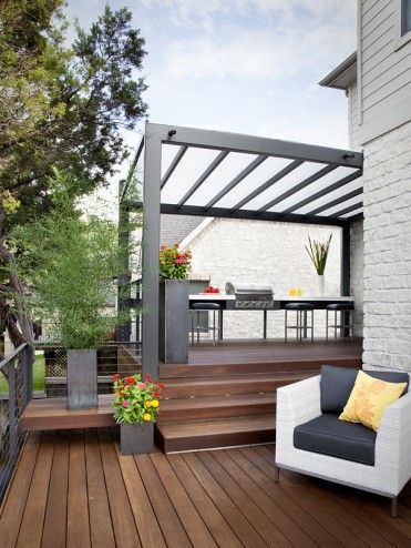 Outside of the steel pergola and rail structure, this layout of backyard steps is relatively on par with what will likely happen at the L² Design Lab. The eating and cooking space is relegated to the upper deck, likely closer to the back door, and the lounging space becomes further removed. Love it.