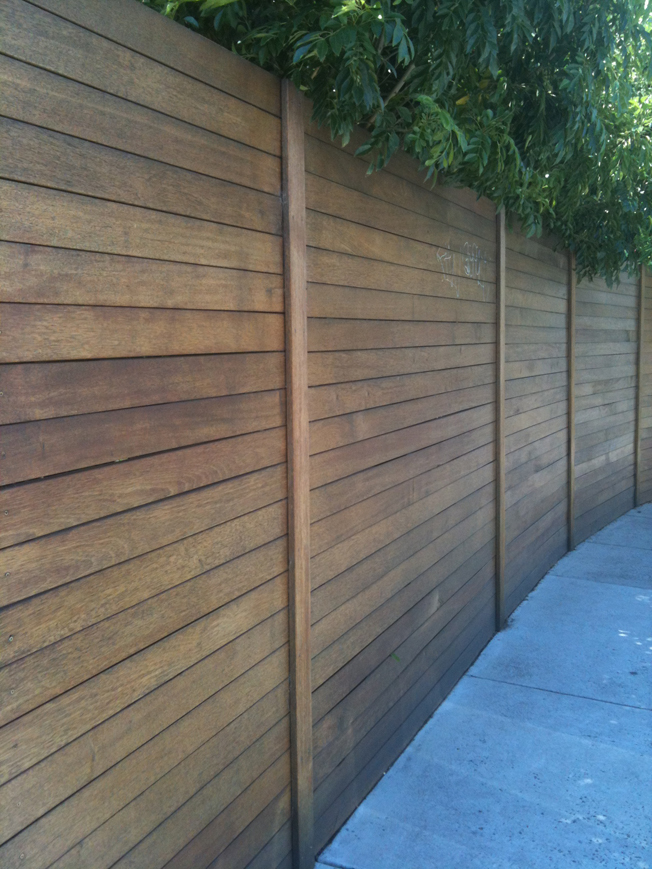 Simple. Clean. Consistent. This modern horizontal fence hits all the marks, and the post rails don't deter from the horizontals too significantly. I'd love to meet the perfectionist who built this. I'd buy him/her a beer or four. #backyard #fence inspiration via www.L-2-Design.com