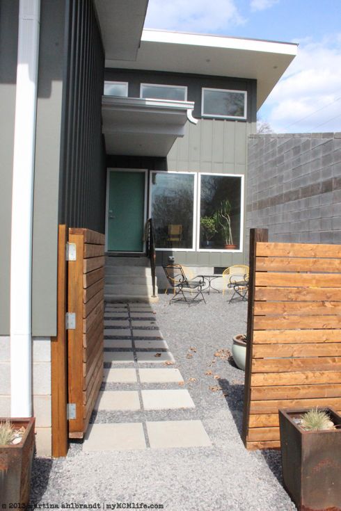 This modern wooden gate is more along the size of the wood I'll be re-using, and well done for a DIY. The only thing that drives my OCD brain nuts (which you can't see in this pic) is that the door sits higher than the fence by a good 2" or so - eek! #modern wooden fence gate inspiration via www.L-2-Design.com