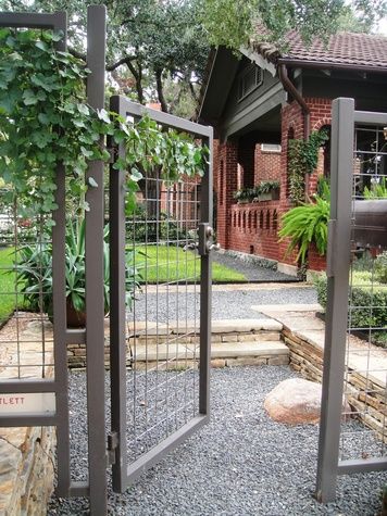 This modern wire fence goes metal all the way! This would have a longevity and minimal maintenance that is wonderful to think about, but the fact that it is all metal has a higher upfront cost than the recycled wood for a modern wood fence. Fence #inspiration via www.L-2-Design.com