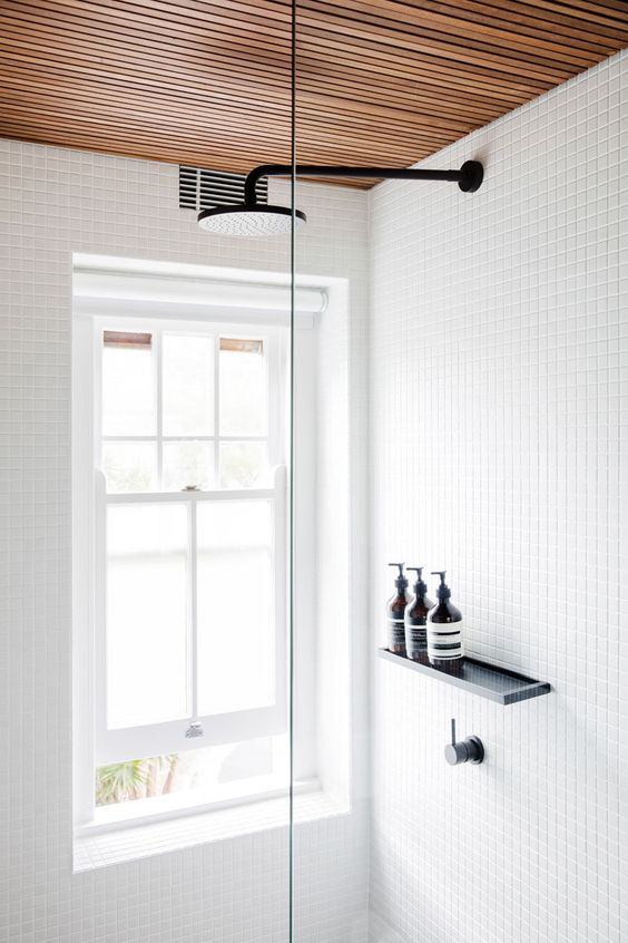 Architect Prineas designed a similarly minimal black shower hardware against white tile bathroom. via www.L-2-Design.com