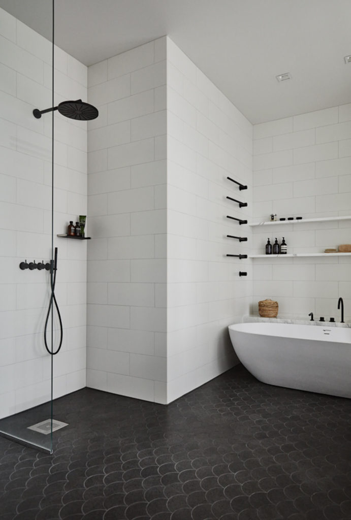 I love the continuation of the theme from Joanna Laajisto. Black shower hardware, black towel rods, black tub tapware. They all sit peacefully in this calm, white bathroom. via www.L-2-Design.com