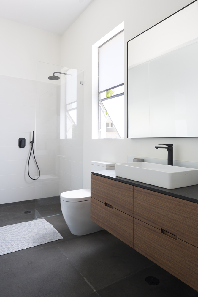 This bathroom by Archifeto is the simplest of the bunch, but don't discount the ability for black shower hardware to make a statement. via www.L-2-Design.com
