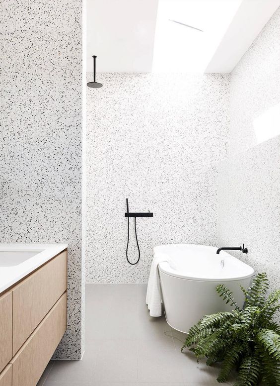 This walk-in shower by Zunica has all the awesomeness: a bathroom tile accent wall, black hardware, wing wall, and massive soaking tub. Throw in a skylight and fern for good measure and you might as well take my heart. #bathroom inspiration via www.L-2-Design.com