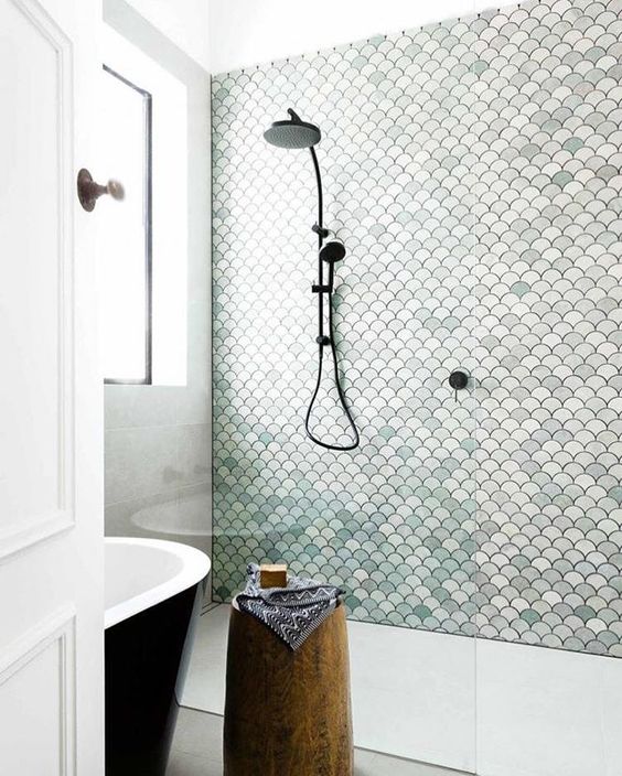 There's something about scallop shell shower tile that always makes me think of the sea and immediately smell a beach breeze and this shower design by Petrina Turner does not disappoint. I love the dark grout and hardware choice - it really makes the shapes pop. I definitely would be a happy girl to wake up to this every day. Bathroom shower tile inspiration via www.L-2-Design.com