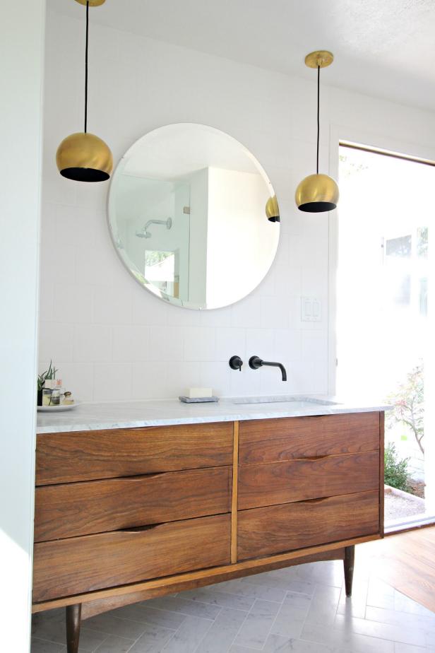 Not floating like the others, but this mid-century modern sink makes use of a dresser or credenza to give flair to this bathroom vanity. Single, offset tapware give space for both washing and prep without cluttering the design.