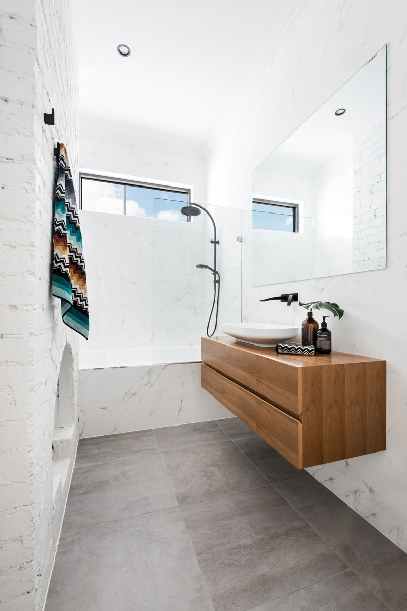 Also a firm that has been featured previously, Dalecki creates a mix of old and new with this modern sink design in a century-old Australian home. By keeping the sink bare bones, they create space for the historic bones of the structure itself to take center attention. (Fireplace in the bathroom, anyone?)