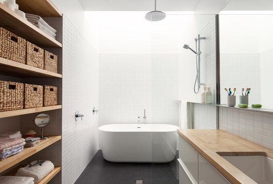 This bathroom skylight design by la SHED uses an expanse of sunlight to light the entirety of the wet space without the need for electrical fixtures. The simple geometric tiles and light woods allow the eye to rest calmly within the space, creating a spa that I wouldn't mind waking up to everyday.