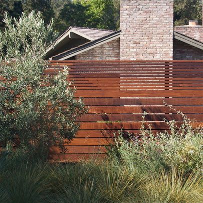 Forget the background for a second. I love this gradient fence design. It provides more privacy at the lower sections (where seating and standard eyesight occurs), while providing more visual continuity and openness in the upper section without sacrificing privacy. #Backyard inspiration via www.L-2-Design.com