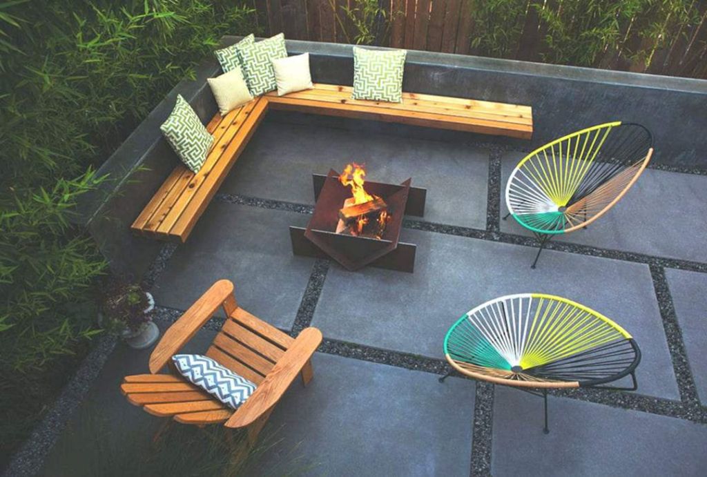 Another great patio design with a spice of color to finish us off this week. I love the contrasting deep concrete finish with the bright woods and accent chairs. Backyard inspiration via www.L-2-Design.com