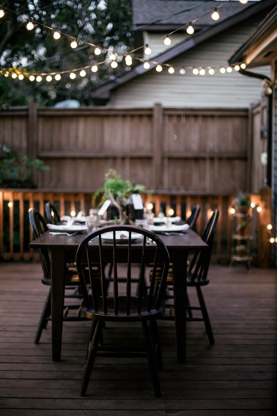 Another beautiful, simple backyard string lights setup to add some cozy light to an evening meal. #backyard inspiration via www.L-2-Design.com