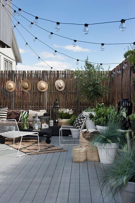 This last backyard string light inspiration image checks all the boxes: varied, comfortable seating; heat source, plants, a variety of lighting types, and lots of texture. #backyard inspiration via www.L-2-Design.com