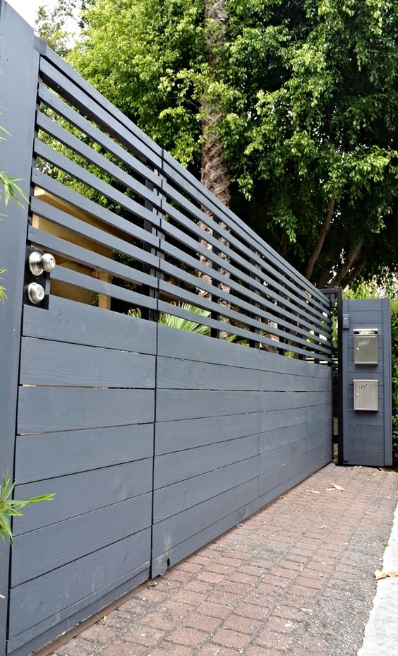 This modern fence gate provides visual security in all the right ways while allowing both pedestrian and vehicle access. #backyard inspiration via www.L-2-Design.com