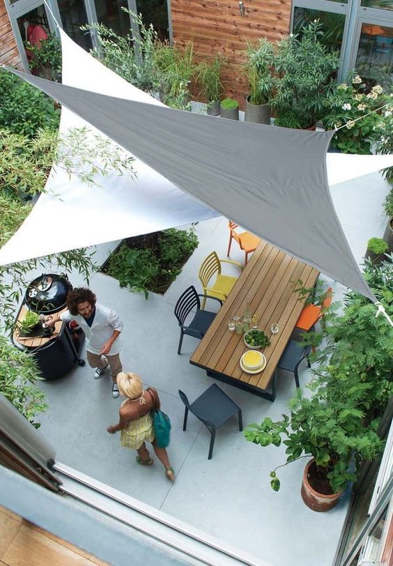 A layering of sails here provides depth to this home courtyard space. It's modern, fun, and functional. #backyard inspiration via www.L-2-Design.com