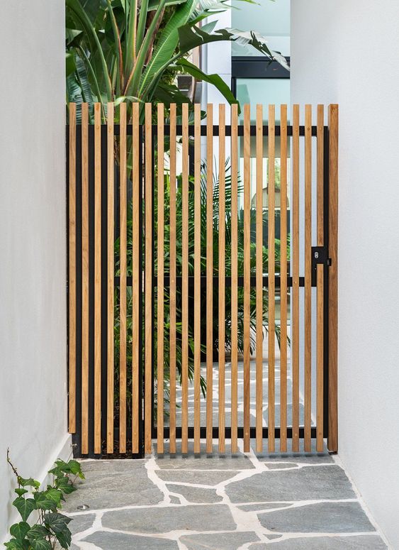 Beautiful continuation of a modern vertical fence and gate. #backyard inspiration via www.L-2-Design.com