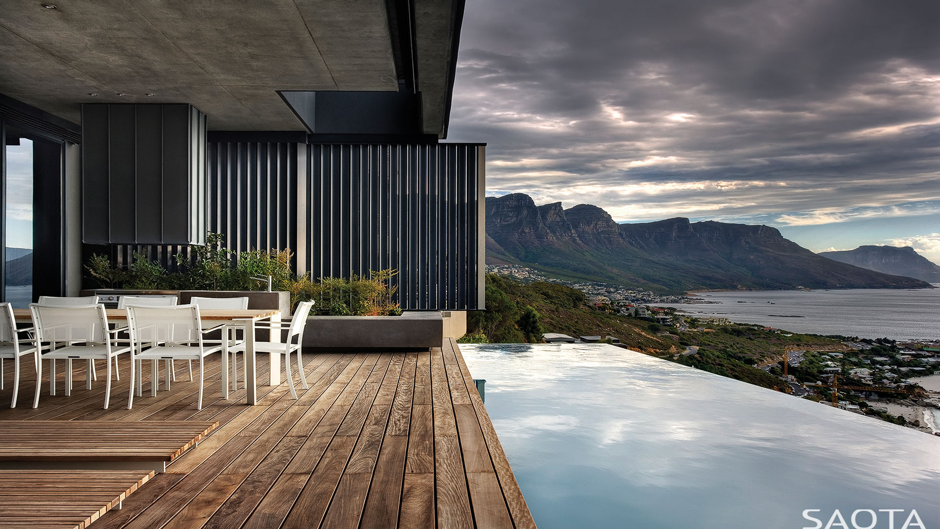 Across the Atlantic and almost as south as you can go on the African continent, SAOTA provide this coastal backyard that opens up to the mountains and sky and sea in equal measure. #coastalbackyard inspiration via www.L-2-Design.com