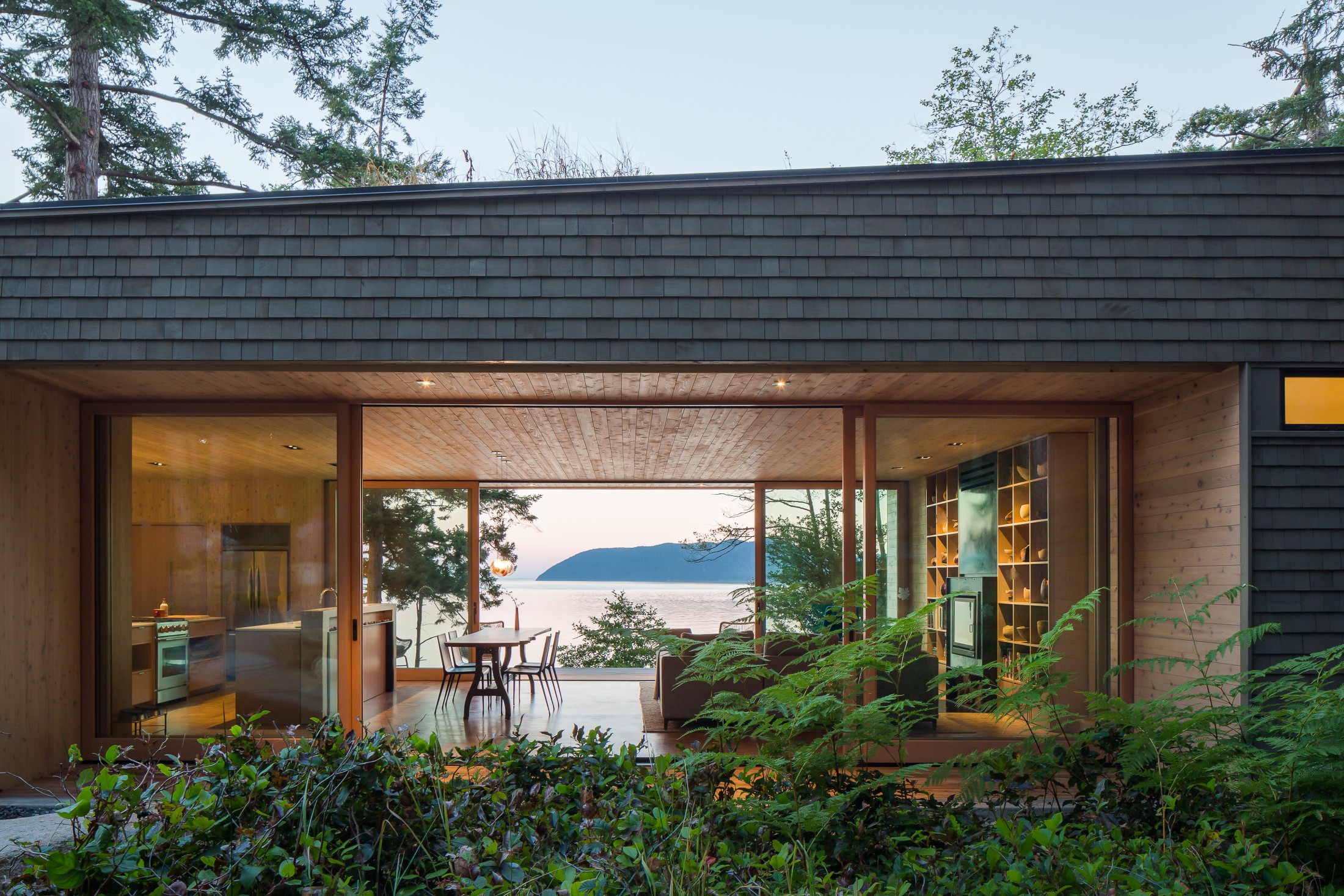 Only slightly lower in latitude, the Lone Madrone by Heliotrope also nestles itself in the rocks of the San Juan Islands. #coastalbackyard inspiration via www.L-2-Design.com