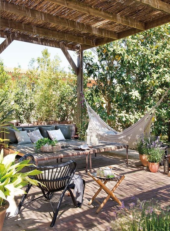 This tropical hammock inspiration can be used for solo relaxing time or while relaxing with friends. #backyard inspiration via www.L-2-Design.com