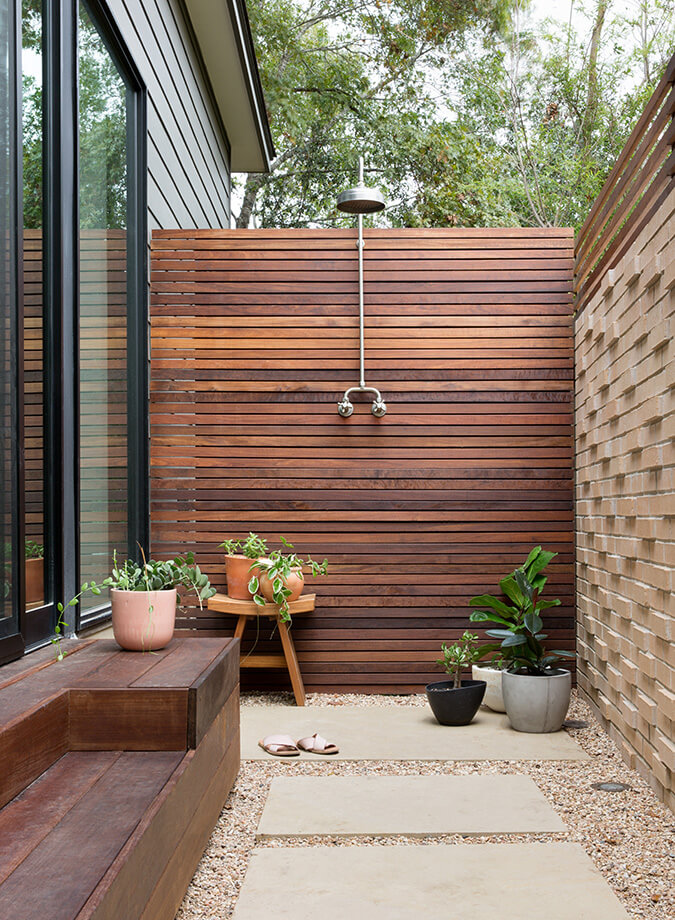 Taking on warmer tones, this outdoor shower mixes materials to provide a private and relaxing space to get clean. #backyard inspiration via www.L-2-Design.com