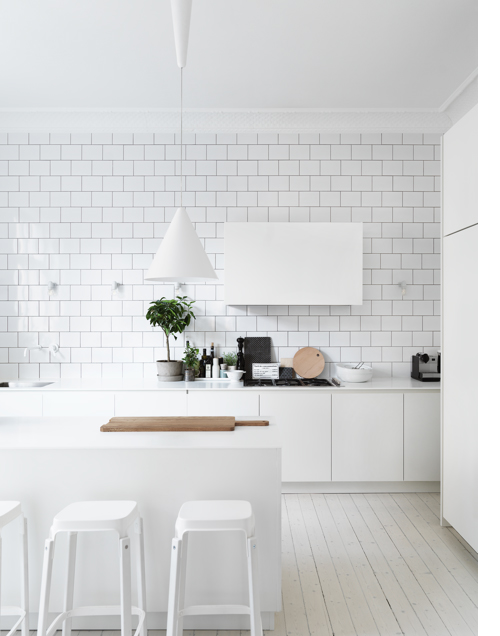 The range hood takes a larger format shape of the same running bond tile surrounding it. #kitcheninspiration via www.L-2-Design.com